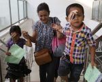 Child patients - Agus _ Nivi Gulo, guiding Theresia up the stairs
